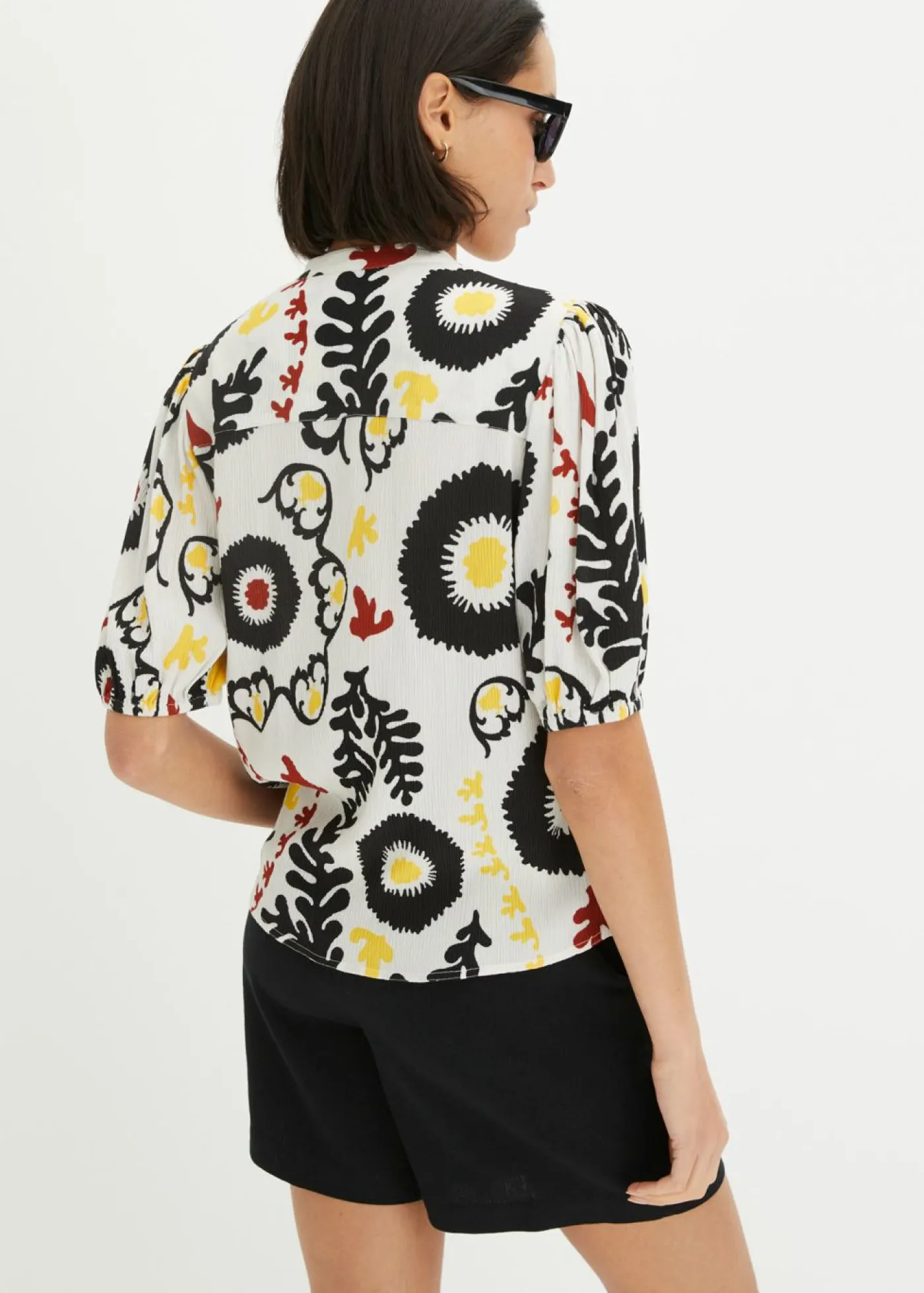 bonprix bonprix Blusa de manga corta de viscosa fluida con detalle de nido de abeja Blanco lana Sale