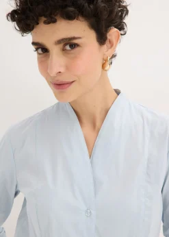 bonprix bonprix Blusa elástica de popelín con cuello chimenea y ligera transparencia azul pálido Best