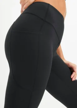 bonprix bonprix Cómodos leggings deportivos con bolsillo para móvil, corte acampanado y material de secado rápido Negro Clearance