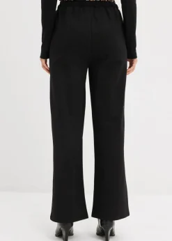 bonprix bonprix Pantalón de chándal ancho con cintura en contraste estampado leo negro Hot