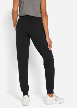 bonprix bonprix Pantalón de chándal de algodón con estampado y corte holgado Negro-blanco estampado Online
