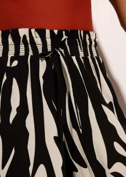bonprix bonprix Pantalón de playa de viscosa fluida Negro-beige New