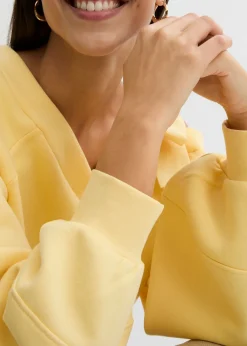 bonprix bonprix Sudadera ancha con un hombro al descubierto Amarillo claro Hot