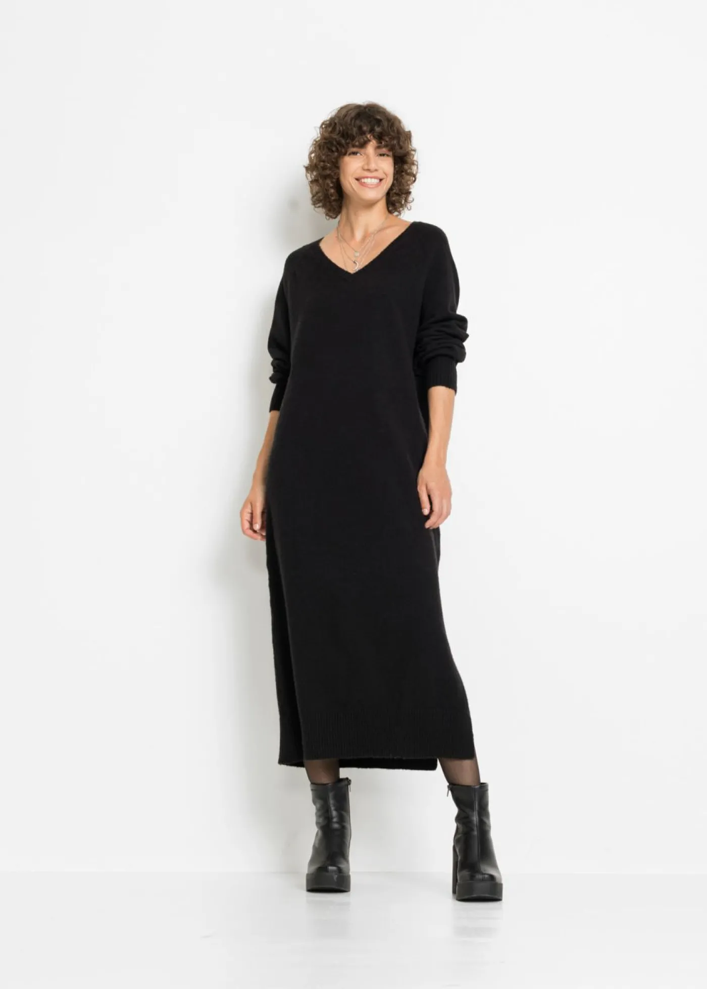 bonprix bonprix Vestido holgado de punto con largo midi Negro Online