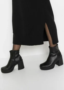 bonprix bonprix Vestido holgado de punto con largo midi Negro Online